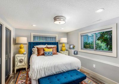 Remodeled Basement Bedroom with Gray Blue and Yellow Color Scheme