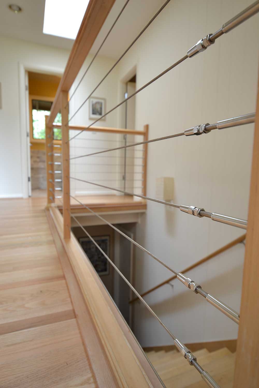 Remodel Staircase with Wooden Floors and Cable Railing