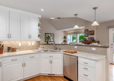 Beautiful White Kitchen with High Counter and Open Concept