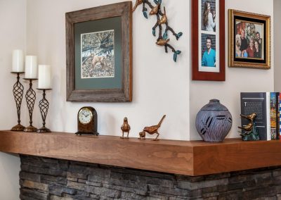 Lake Oswego Fireplace Mantel with Decorations and Paintings Hanging Above