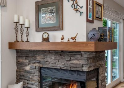 Modern Fireplace with Stone Features and Wood Mantel
