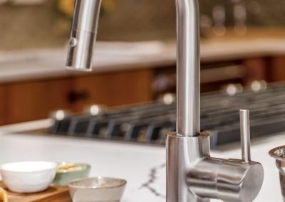 Modern Chrome Faucet on White Marble Island Countertop